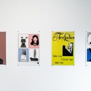 an image of a gallery wall with four artworks. Titles in the photo caption.