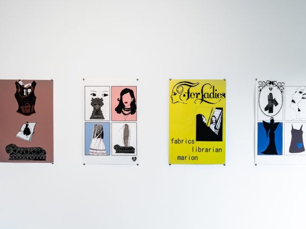 an image of a gallery wall with four artworks. Titles in the photo caption.