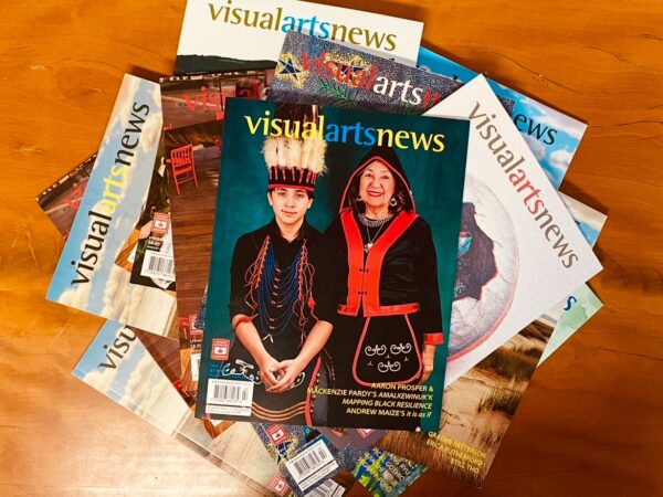 Image of a stack of a variety of copies of Visual Arts News